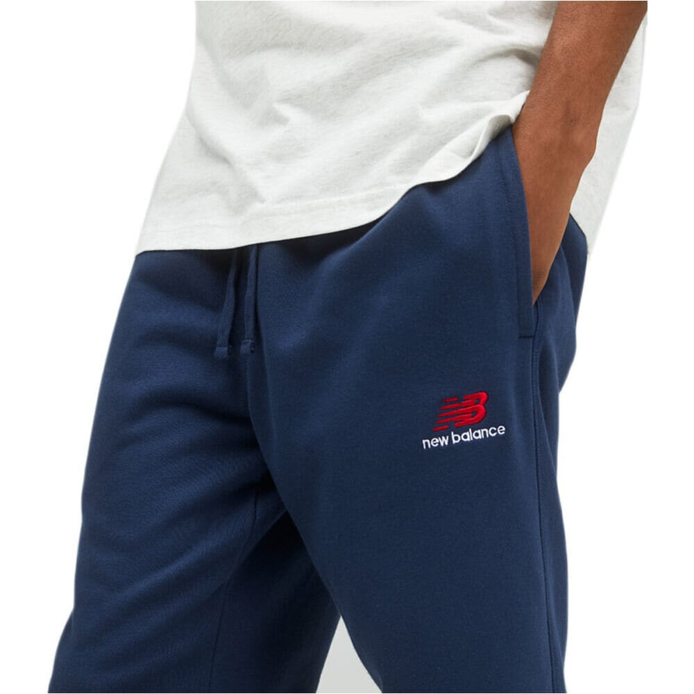 New Balance pantalón hombre Uni-ssentials FT pant 03